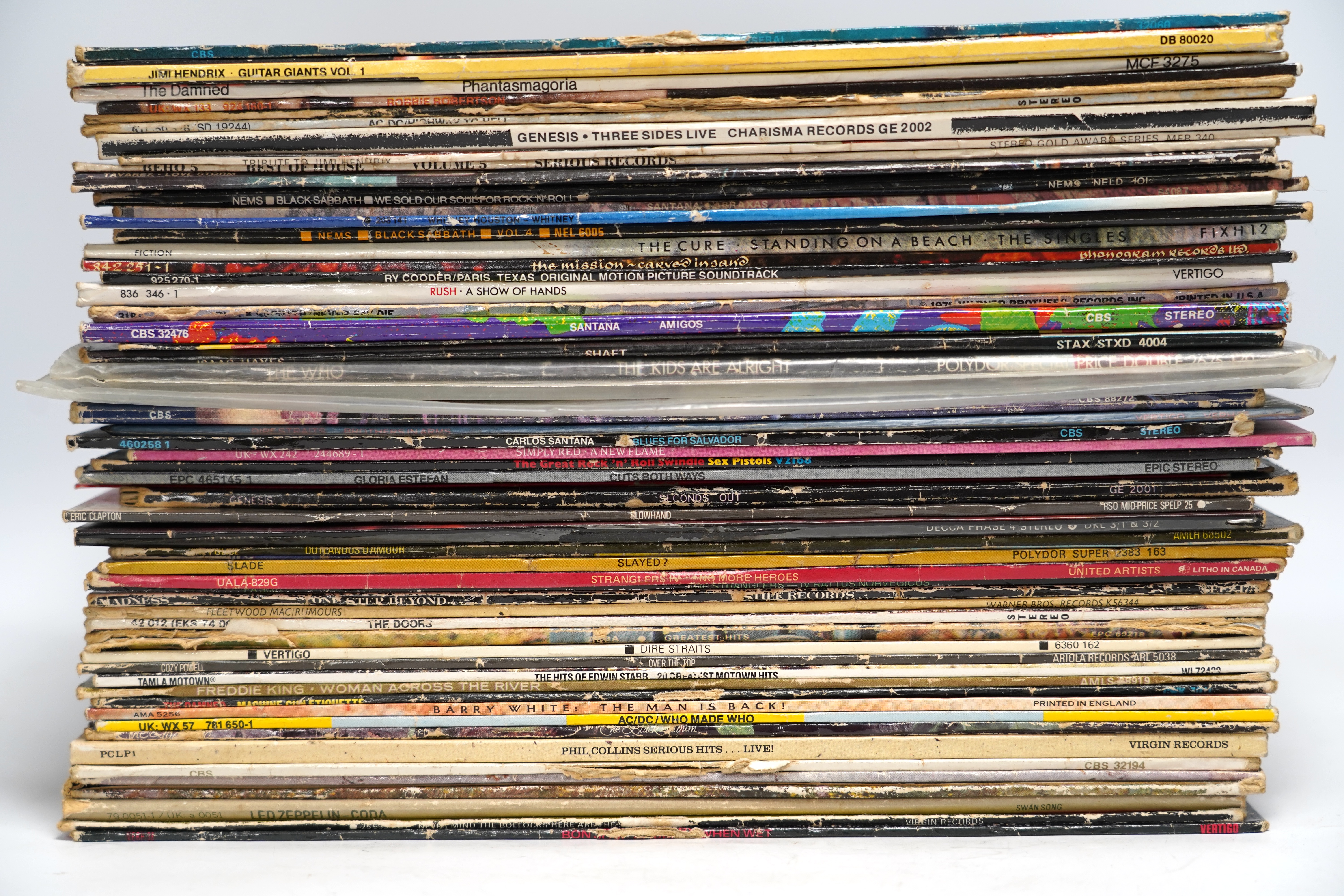 Fifty-five LP record albums, artists including; Led Zeppelin, Sex Pistols, The Stranglers, Madness, Fleetwood Mac, The Doors, Dire Straits, The Damned, AC/DC, Phil Collins, Santana, Simply Red, Genesis, Eric Clapton, The